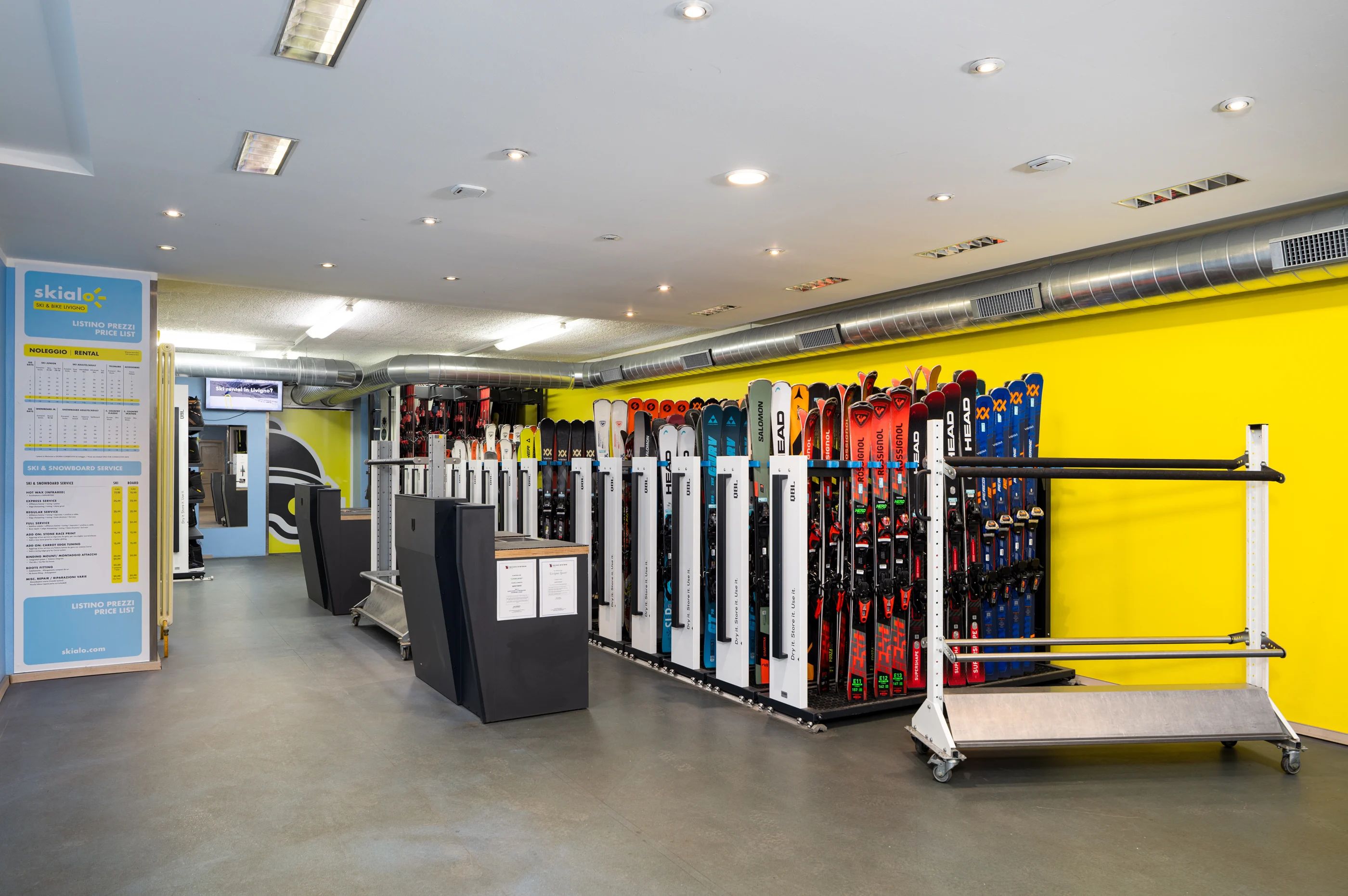 Inside the Skialo rental shop in Livigno, with skis ready for pickup
