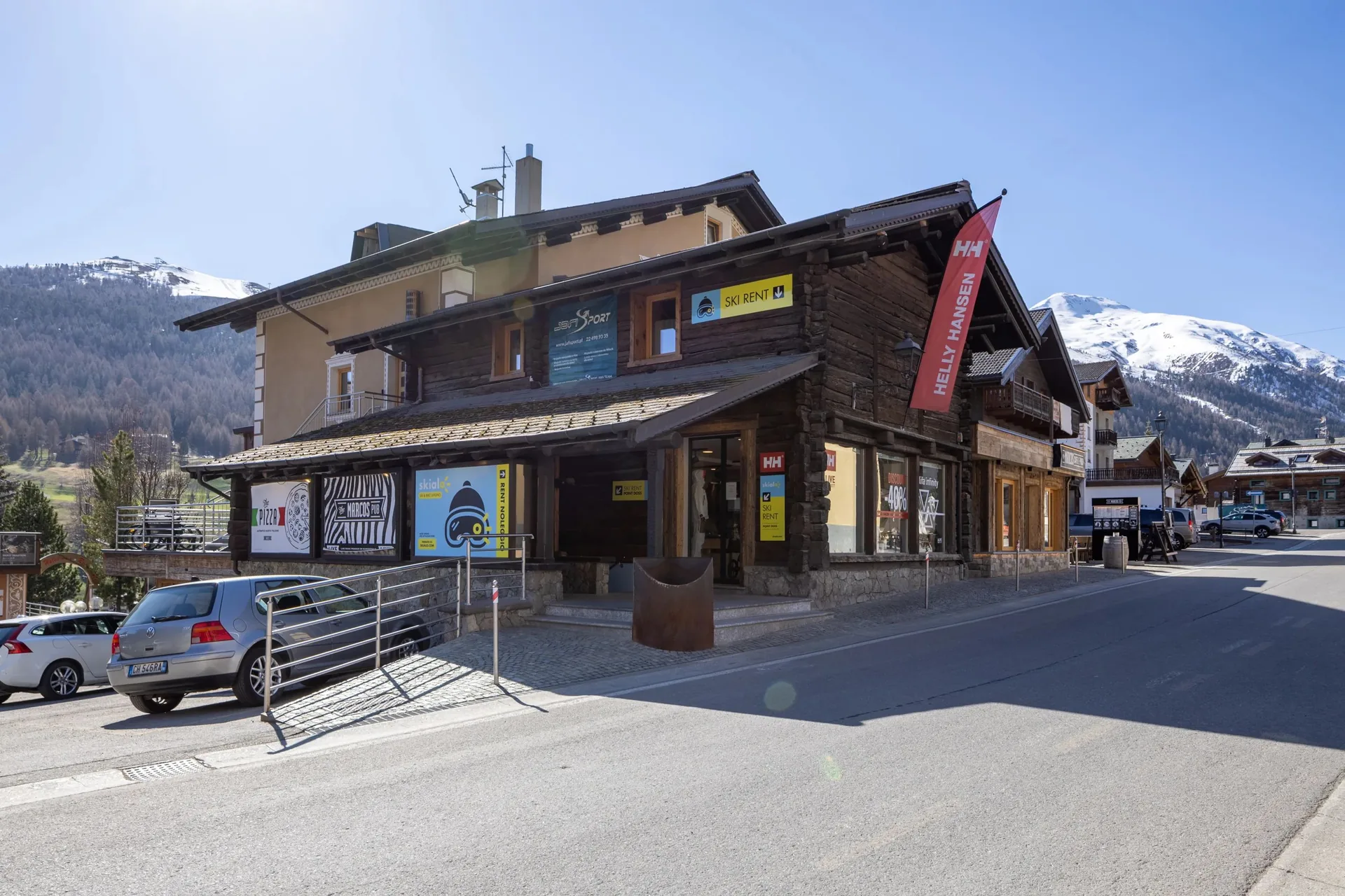 The Skialo Doss shop in Livigno, with the snow-covered peaks behind